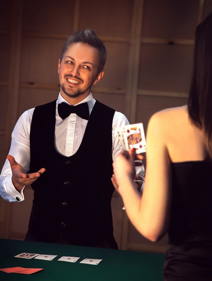 Live blackjack dealer at Joker Gaming studio with multi-camera HD setup